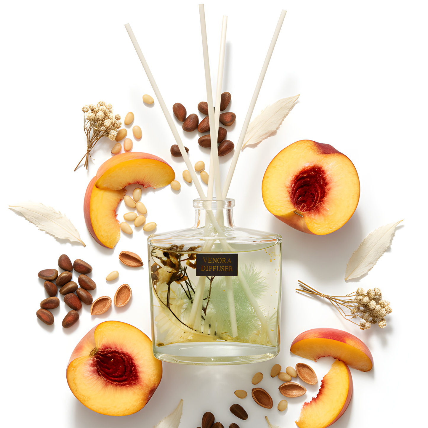 Minimalist flatlay of Venora Golden Peach diffuser with peach, pine, white tea, and botanical elements arranged in a luxury fragrance layout.
