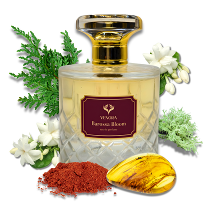 Barossa Bloom perfume bottle styled with saffron, jasmine, amber resin, and cedar elements representing its fragrance notes.