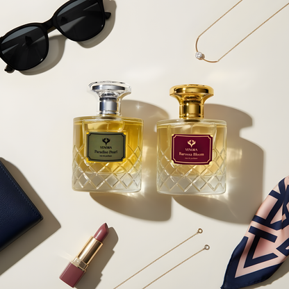 Flatlay of the Luxury Lovers Gift Set with both perfumes arranged alongside romantic elements like petals and soft candlelight.