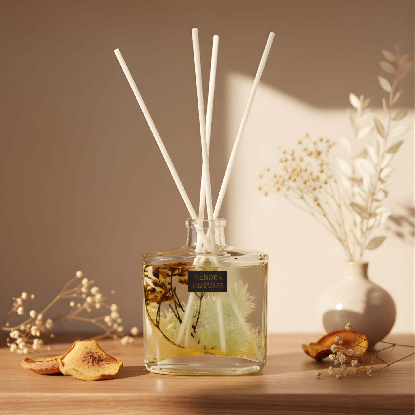 Luxury Golden Peach reed diffuser placed in a warm interior setting with natural dried florals and soft lighting, creating a gentle, elegant ambience.