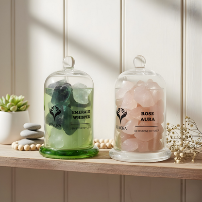 Rose Aura and Emerald diffusers styled in a peaceful home setting with soft light, natural décor, and a calming zen atmosphere.