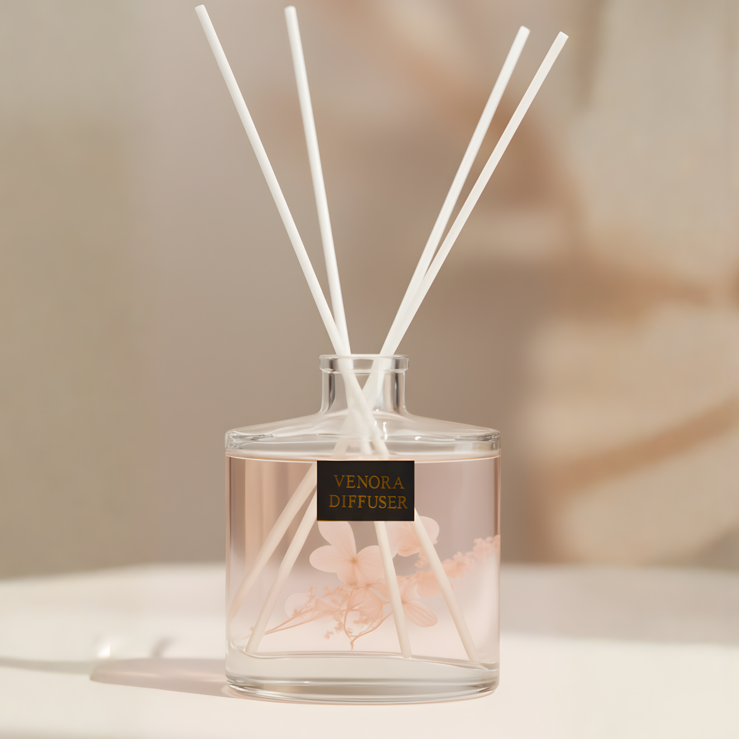 Cinematic close-up of Venora Secret Garden diffuser with reeds and dried botanical details, warm highlights, and elegant shadows.