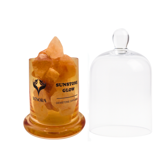 Sunstone Glow Gemstone Diffuser by Venora with genuine sunstone crystals inside a clear glass vessel on a white background.